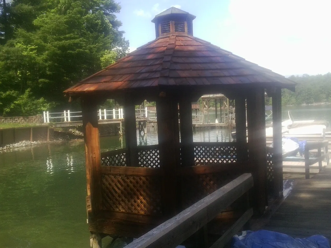 Cedar shake gazebo roof rebuilt on a lake dock in The Plains